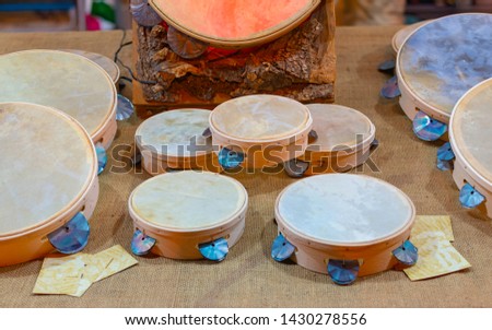 Typical small handmade Salento tambourines for sale on a stall during a festival