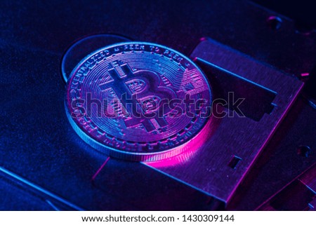 golden bitcoin on floppy disk