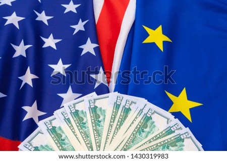 et, finance and nationalism concept - close up of american flag and cash money