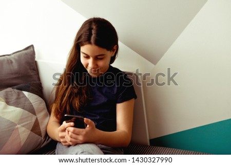 Smiling Teenager with mobile phone 