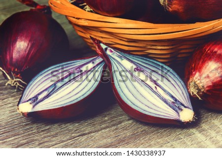 Sliced ripe juicy red onion on a cutting board. 