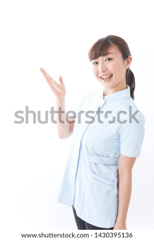 Young nurse pointing to something