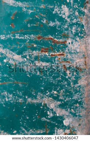Texture of old paint and broken greenish blue.