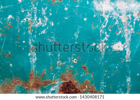 Texture of old paint and broken greenish blue with oxidation.