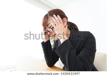 Business woman suffering from over time job