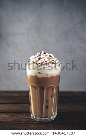 Cold frappe coffee with whipped cream Royalty-Free Stock Photo #1430417387