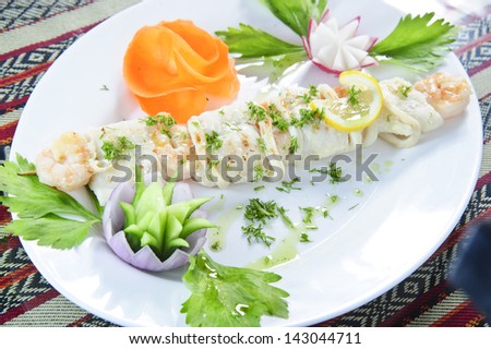 Picture of tasty cooked sea food plate.