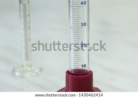 Medical laboratory. On the table are measuring cylinders. Royalty-Free Stock Photo #1430462414