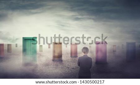 Businesswoman in front of many different doors choosing one. Difficult decision, important choice concept, failure or success. Ways to unknown future, business career development opportunity. Royalty-Free Stock Photo #1430500217