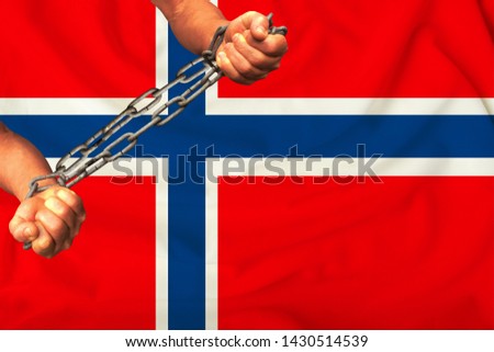 men's hands chained in heavy iron chains against the background of the flag of Norway on a gentle silk with folds in the wind, the concept of movement in support of human rights