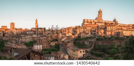 Panorama of Siena, cityscape, a beautiful medieval town in Tuscany, with view of the Dome Bell Tower of Siena Cathedral (Duomo di Siena), landmark Mangia Tower and Basilica of San Domenico, Italy Royalty-Free Stock Photo #1430540642