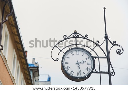 Old medieval clock on a city street. Zelenogradsk