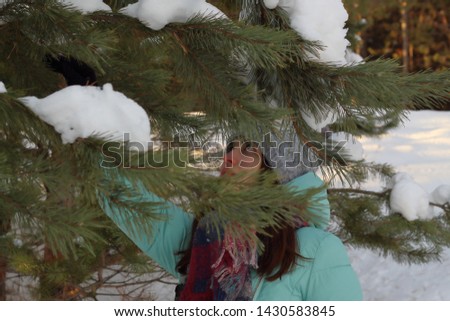 girl in the coniferous forest in winter