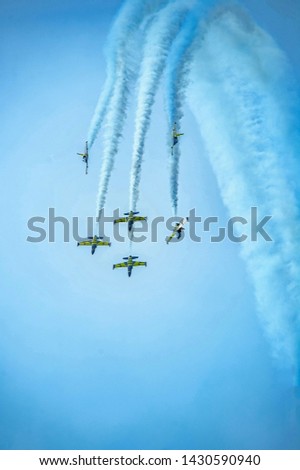 Airplanes on airshow. Aerobatic team performs flight at air show stock photo