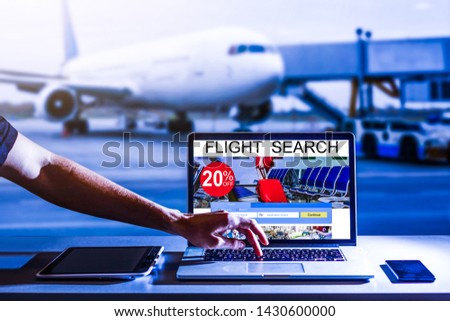 Blank screen laptop computer with airplane background