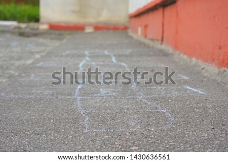 
Retro photography play hopscotch on the pavement of the school