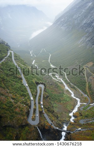 spellbinding landscape of Norwegian nature roads among high charming mountains and hills in which it is impossible not to fall in love imprinted on photos of traveler