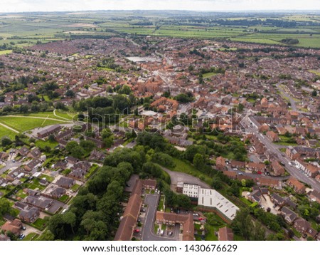Aerial photo of the UK town of York in North Yorkshire, England showing rows of houses, roads and a typical British housing estates on a sunny day