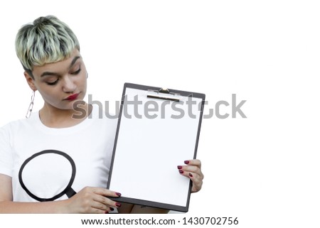 Young woman holding a sheet of paper, place for text. Copy space. Close-up.i solated on the white background.
