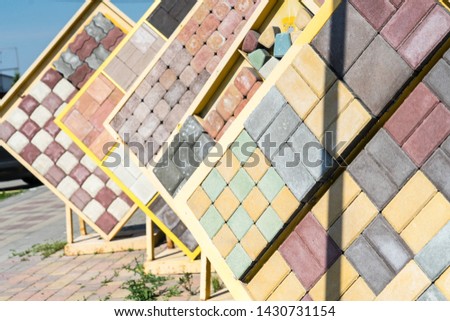 Sale of tiles for the sidewalk and tracks.