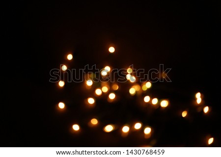 White little bokeh, blurred light on black background for celebration