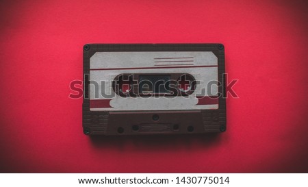audio cassette on a red background