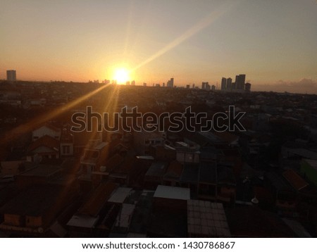 Silhouette of office buildings in downtown Surabaya at sunset time