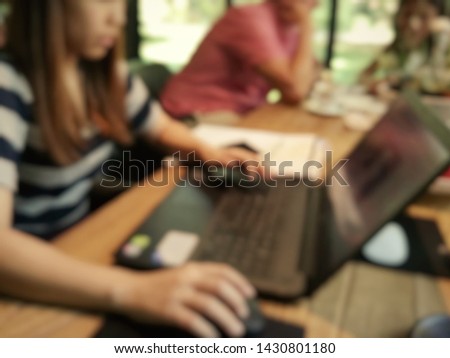 Blur woman working on the laptop in cafe, hands and laptop

