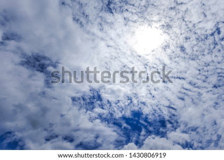 Sky background with the fluffy white clouds 
