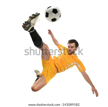 Soccer player kicking the ball isolated on a white background Royalty-Free Stock Photo #143089582