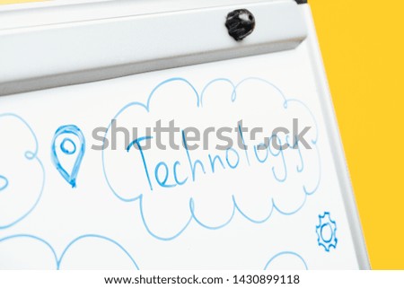 close up view of word technology written on white flipchart
