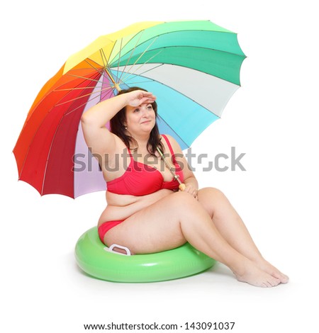 Funny obese woman on the beach.