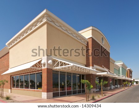 Row of new stores in outdoor mall. Royalty-Free Stock Photo #14309434