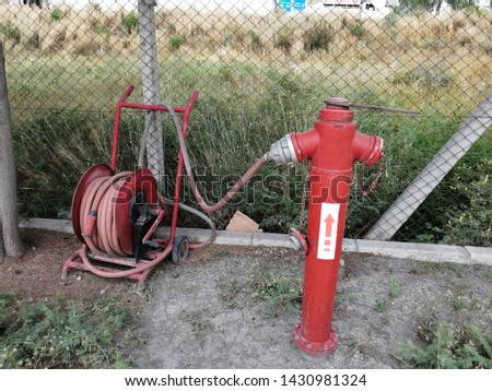 red fire valve in the garden