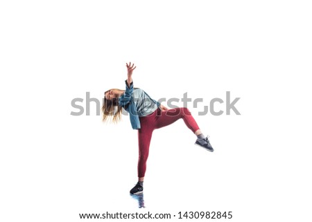 Young woman is training gymnastics on isolated white background