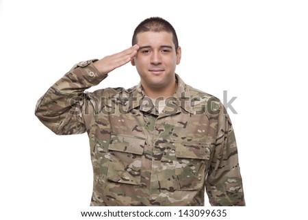 Portrait of a smiling young soldier saluting 