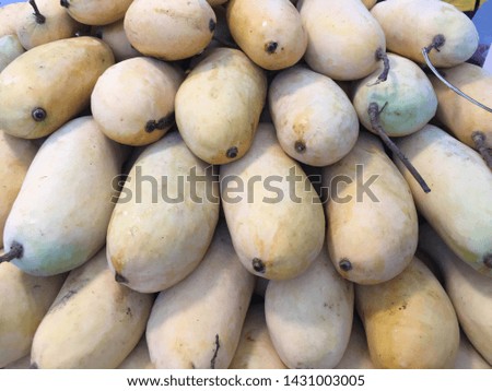Ripen yellow mangoes closed up full frame for background wallpaper