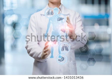 The doctor adjusts the health of the person on the blurred background. Royalty-Free Stock Photo #1431013436