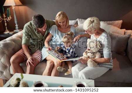 Parents with female child and grandma having fun