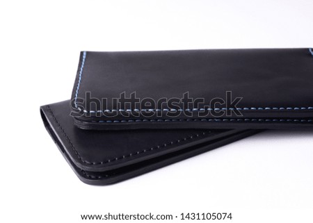 Two handmade leather black purse isolated on white background. Stock photo of luxury accessories.