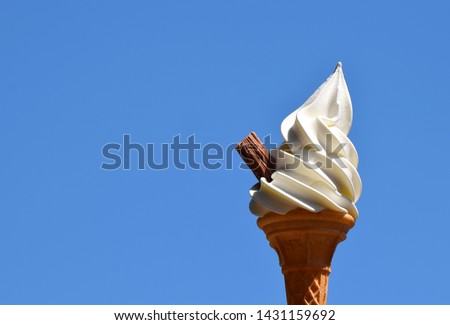 Whipped soft vanilla ice cream in a cone with a chocolate flake. Often known as a Flake 99 or Mr Whippy Royalty-Free Stock Photo #1431159692