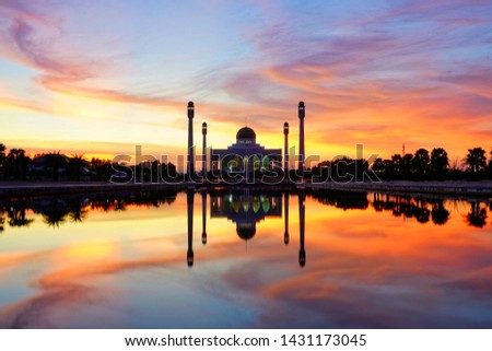 Sihouette picture with long exposure of Hat Yai central mosque(masjid) with reflection pool in a beautiful twilight dusk light, Songkla, Thailand