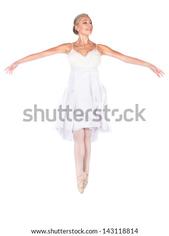 Beautiful female ballet dancer isolated on a white background. Ballerina is wearing a white feathered dress and pointe shoes.