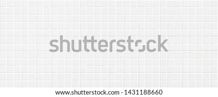 white ceramic tile with many little squares in wide screen form
