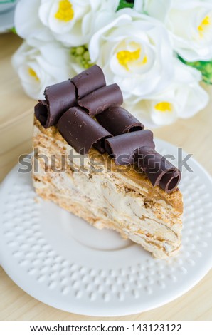 Coffee cake in white dish on the wood table