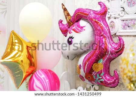 Decoration balloons for children's birthday. Holiday for girls in pink style. Balloon unicorn. Children's photozone