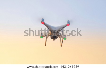 drone quadcopter flying with sky on background