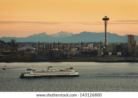 Seattle Ferry and the Space Needle. A Seattle super ferry makes its way across Elliott Bay headed toward Bainbridge Island.