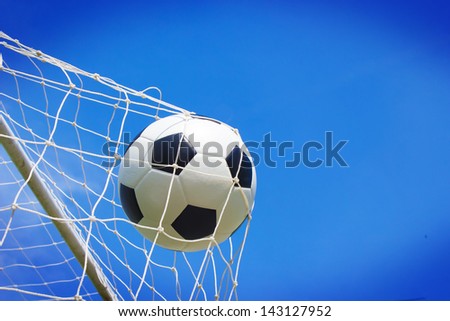 soccer ball in goal Royalty-Free Stock Photo #143127952