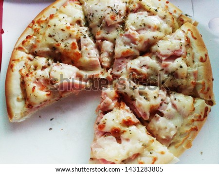Ham, cheese and pineapple pizzas